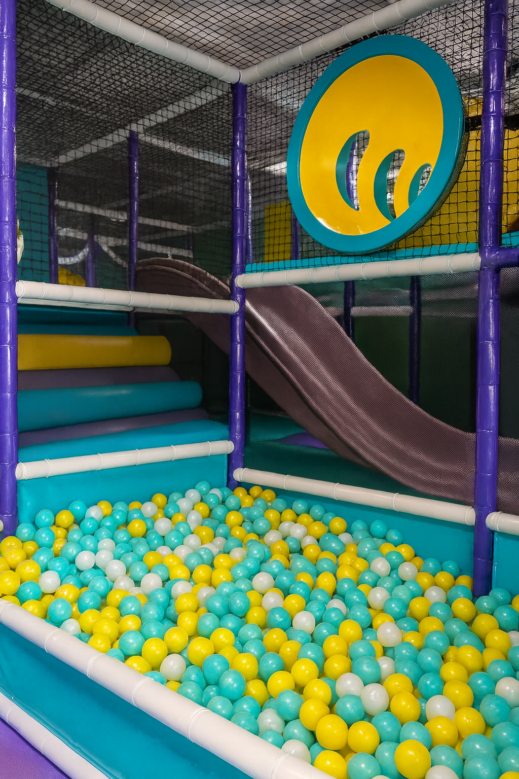 Ball Pit Paradise - Dive into thousands of colorful balls for sensory fun.