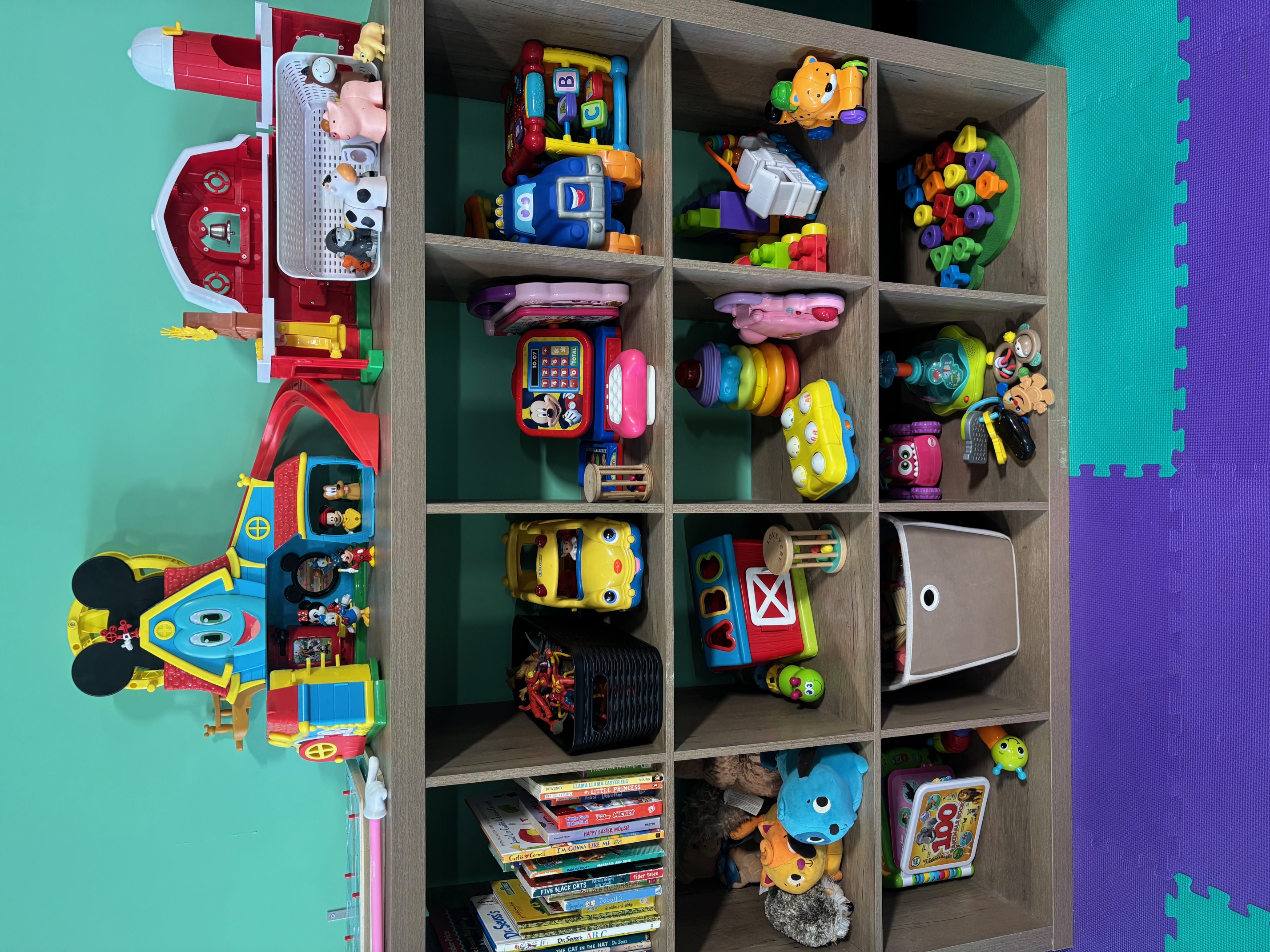 Toy Cubbies - Low shelves and soft toys for littlest explorers.
